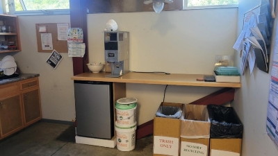 The office kitchenette. The two food scrap buckets are under a counter next to the fridge.